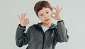 A young boy making the sign for OK with both hands. Image by Victoria from Pixabay.&nbsp;